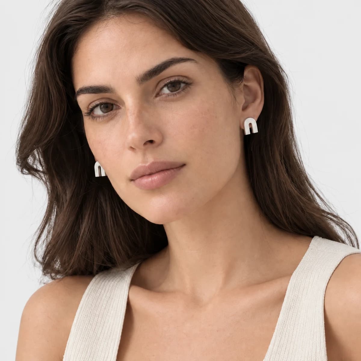 Columnar Arch Studs, Sterling Silver — worn on a model