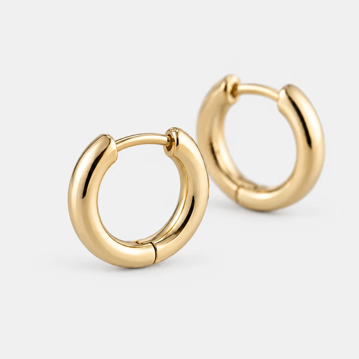 Micro Huggie Hoops, 14k Solid Gold — close-up detail