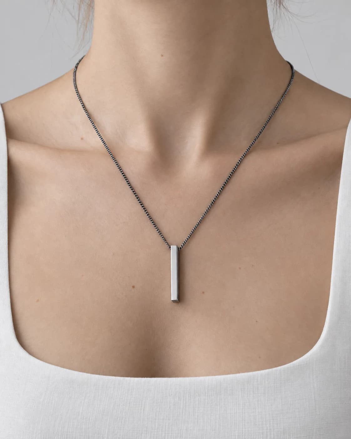 Monolith Bar Pendant, Sterling Silver — worn on a model