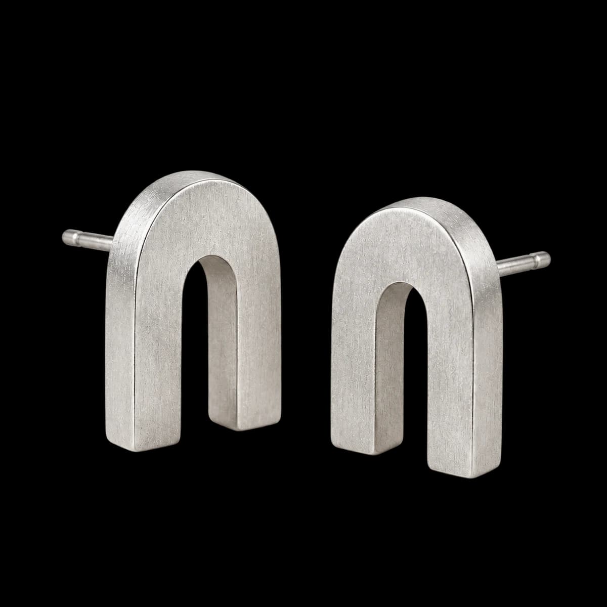 Columnar Arch Studs, Sterling Silver — studio view