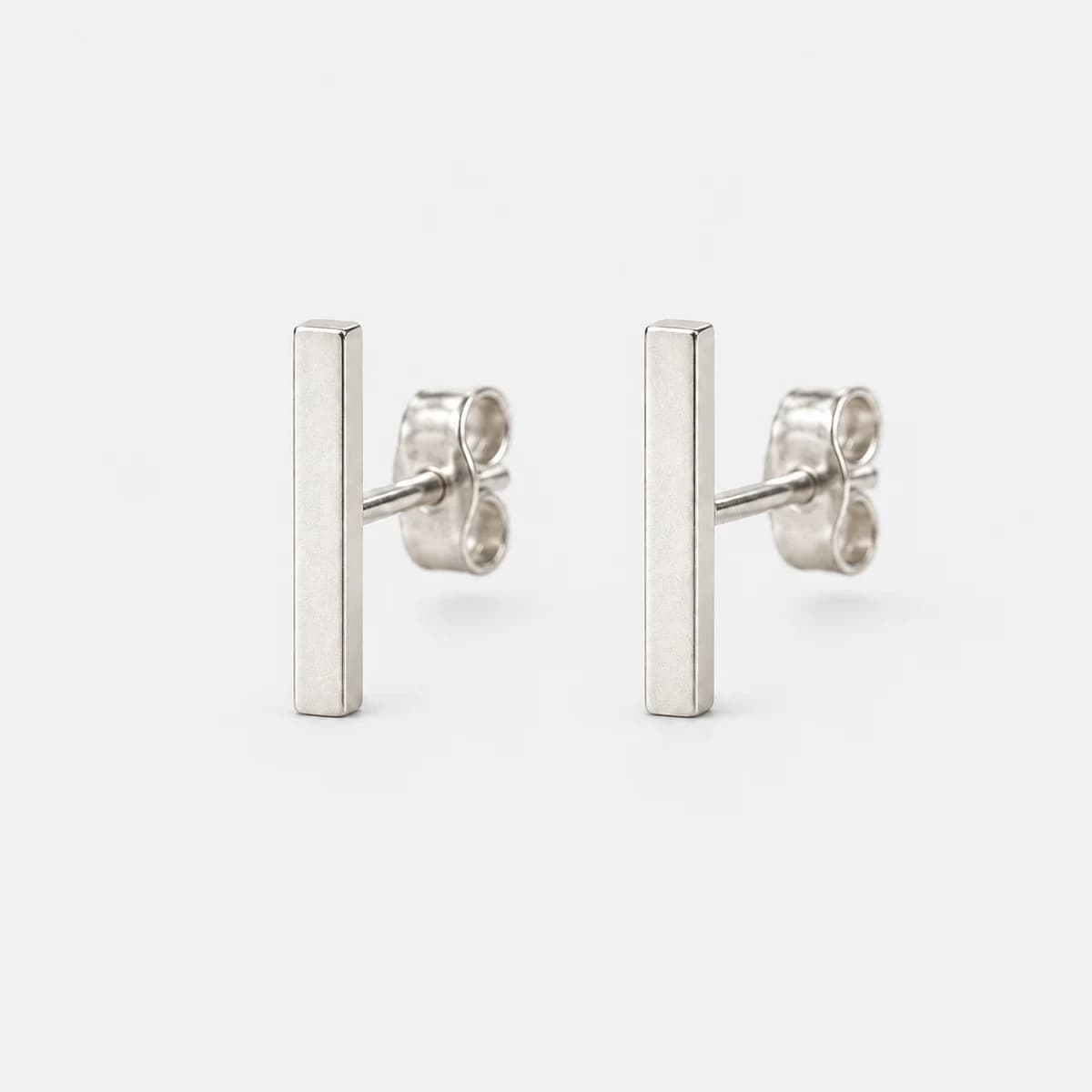 Hairline Bar Studs, Sterling Silver — studio view